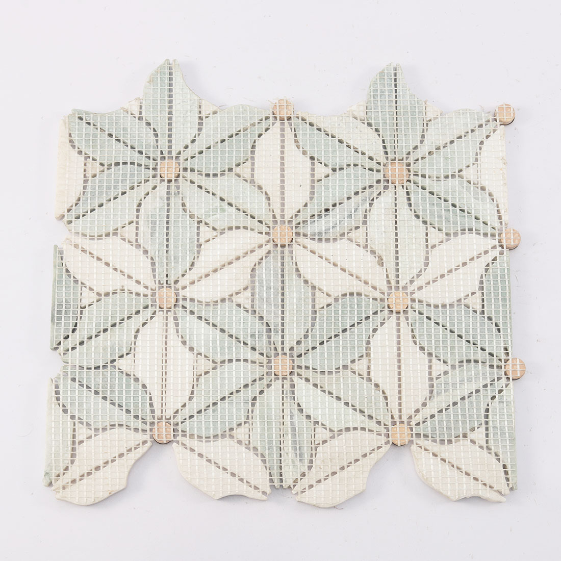 Back view of green white flower marble mosaic tile with fiber mesh backing