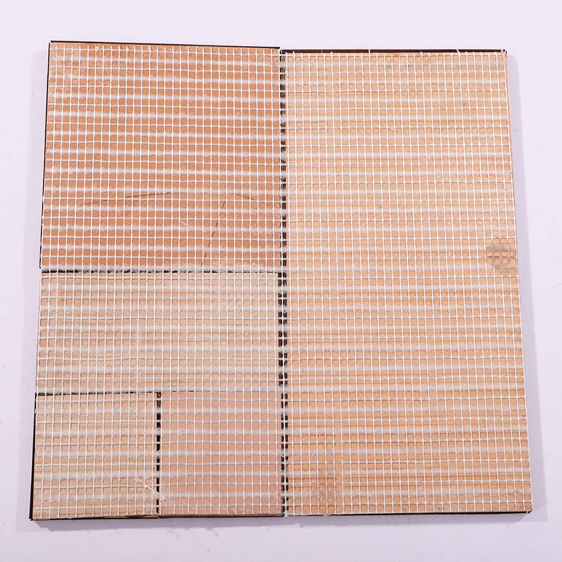 Back view of mesh backed copper metal mosaic tile sheet