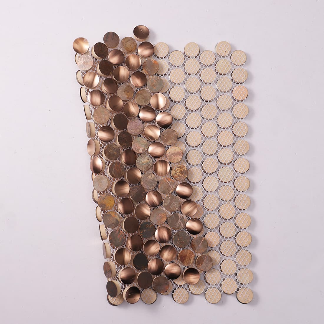 Mesh backed copper penny round mosaic tile showing flexible sheet construction