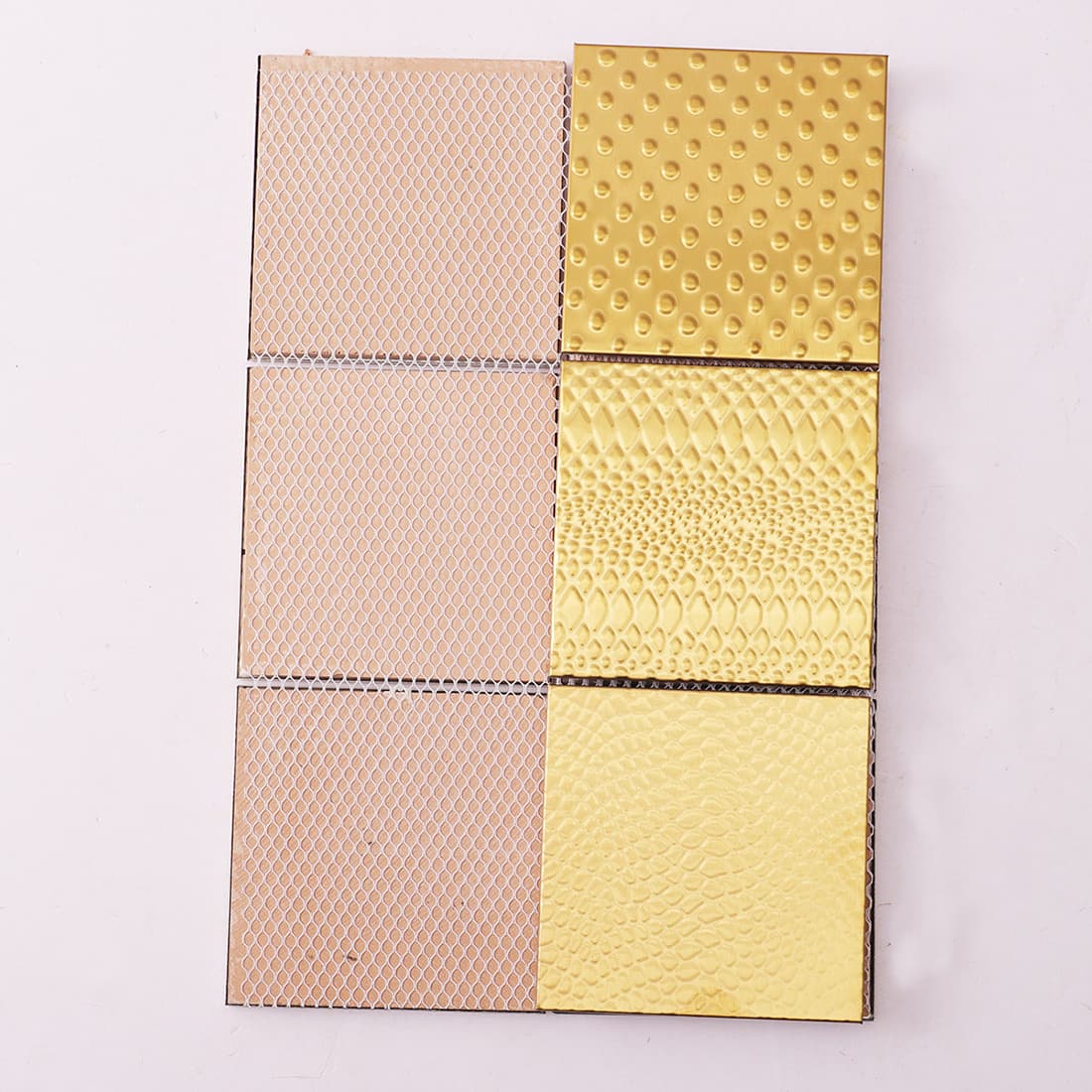 Back view of mesh mounted gold square metal mosaic tile sheet