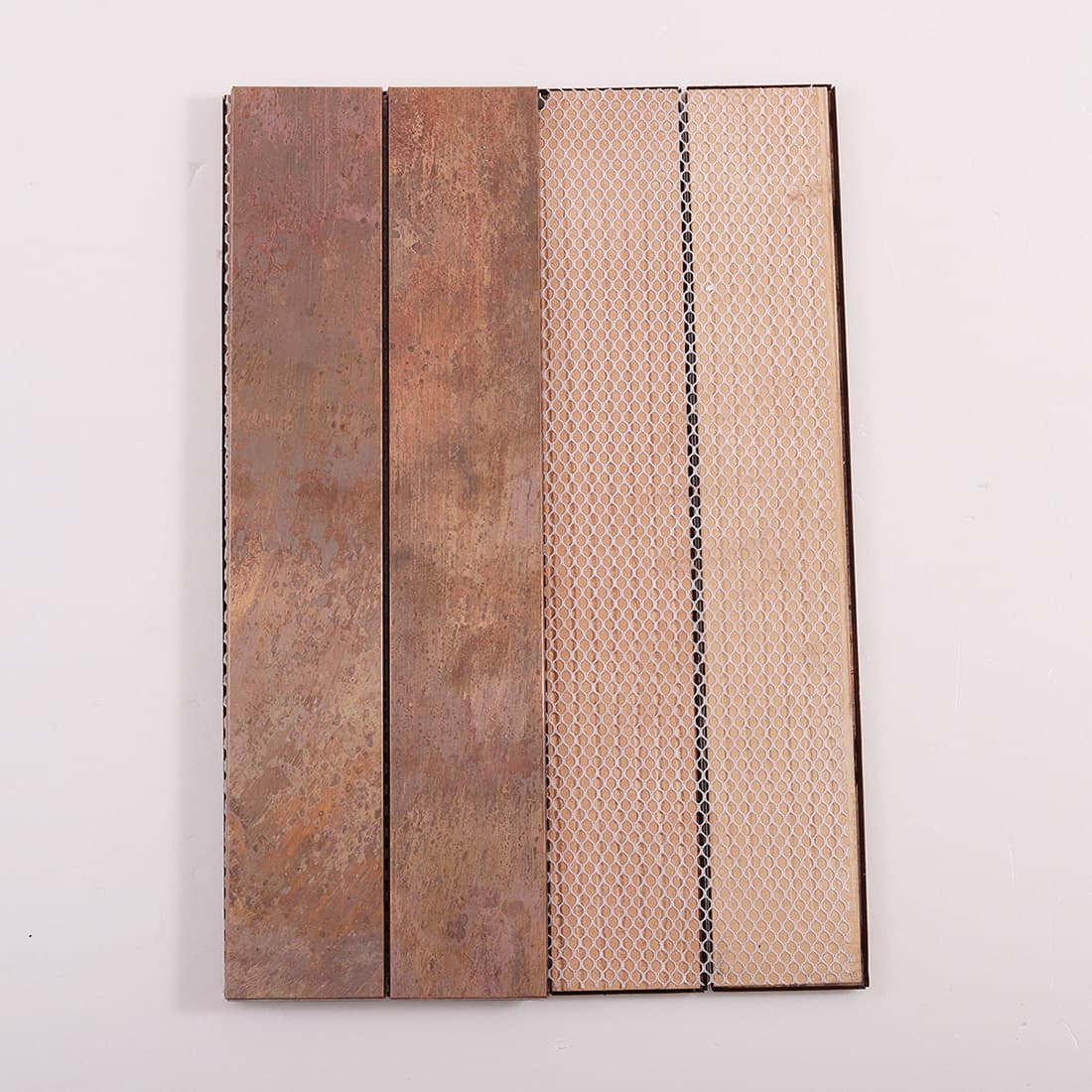 Mesh backed oxidized copper rectangular tile with long strip construction