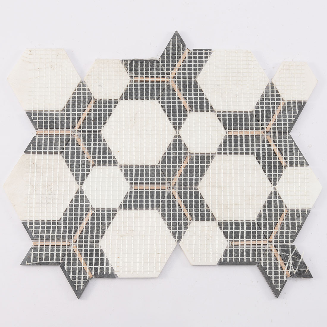 Mesh-backed white hexagon geometric mosaic tile with black and gold accents