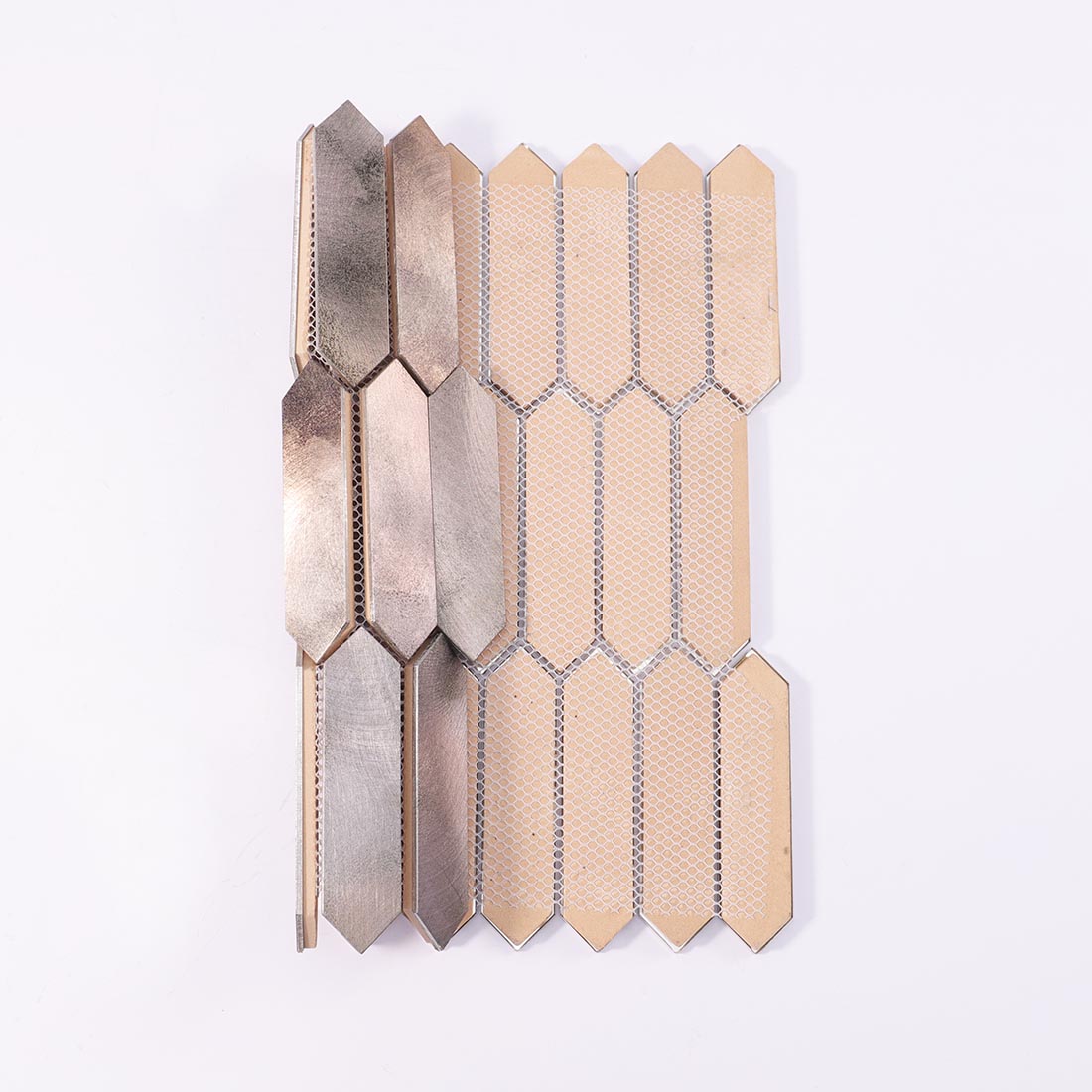 Mesh backing on reverse side of antique champagne gold picket aluminum mosaic sheet
