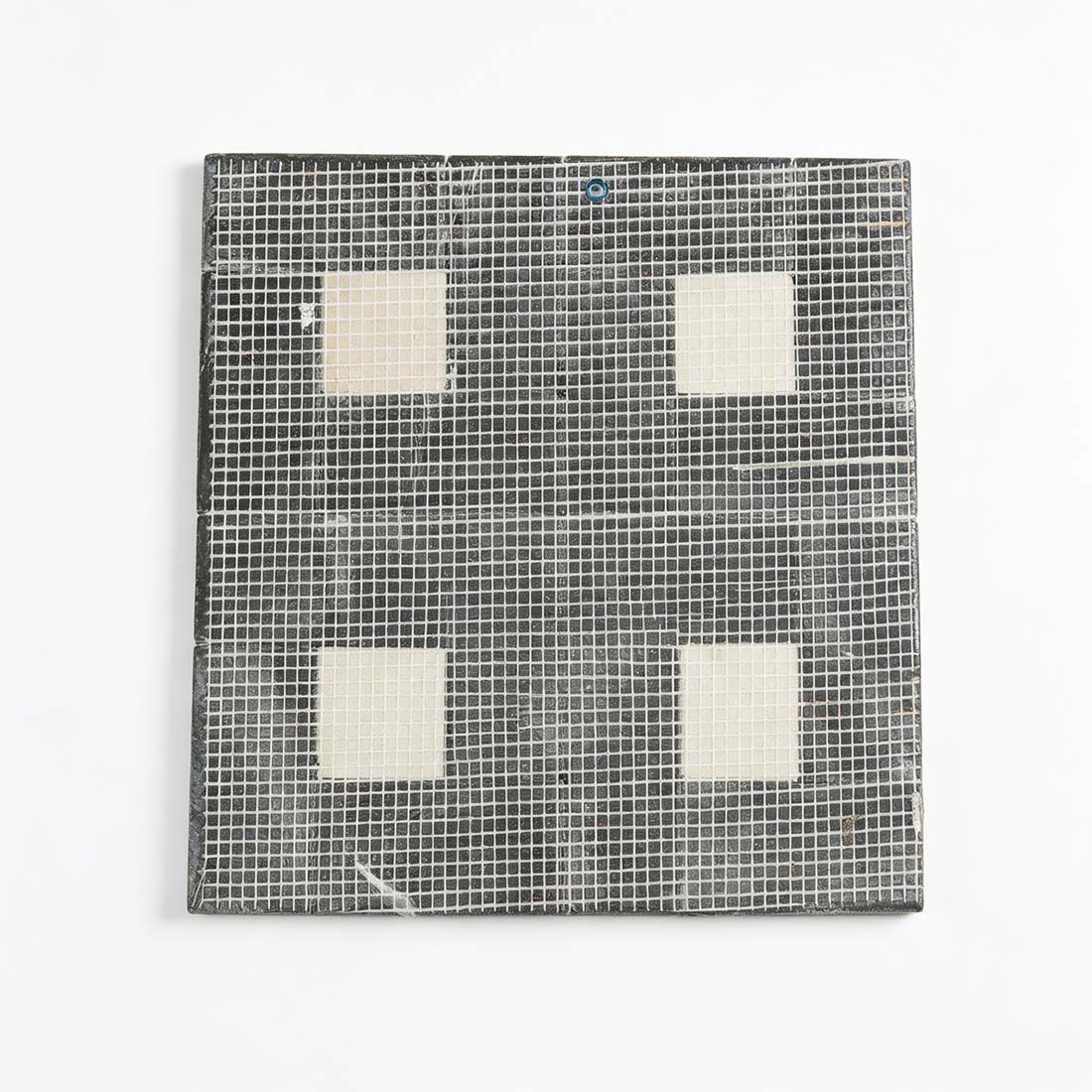 Mesh backing on the reverse side of black and beige marble sheet