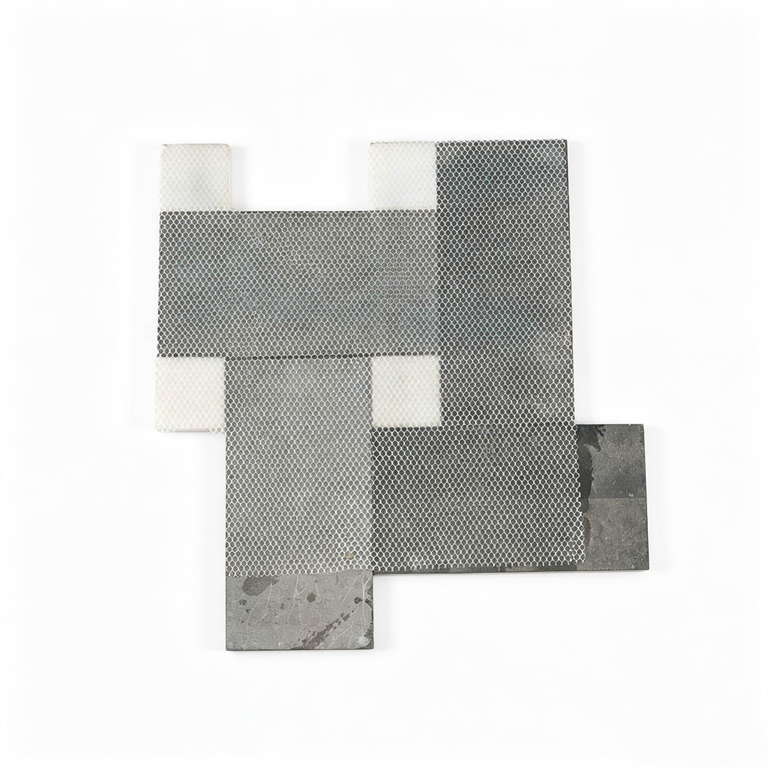 Mesh backing on the reverse side of black and white marble mosaic