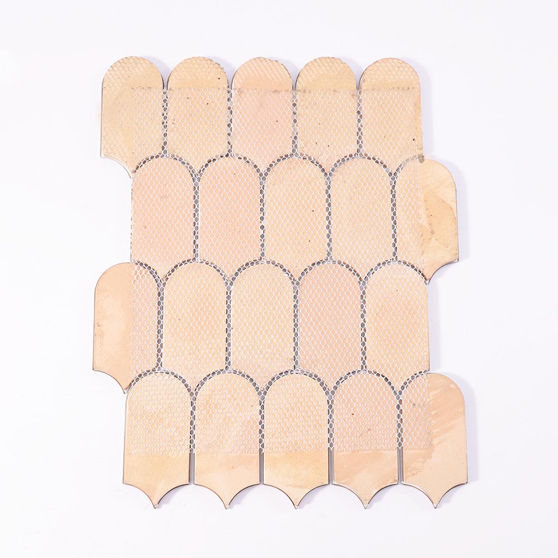 Mesh backing on reverse side of blue gold arched aluminum mosaic sheet