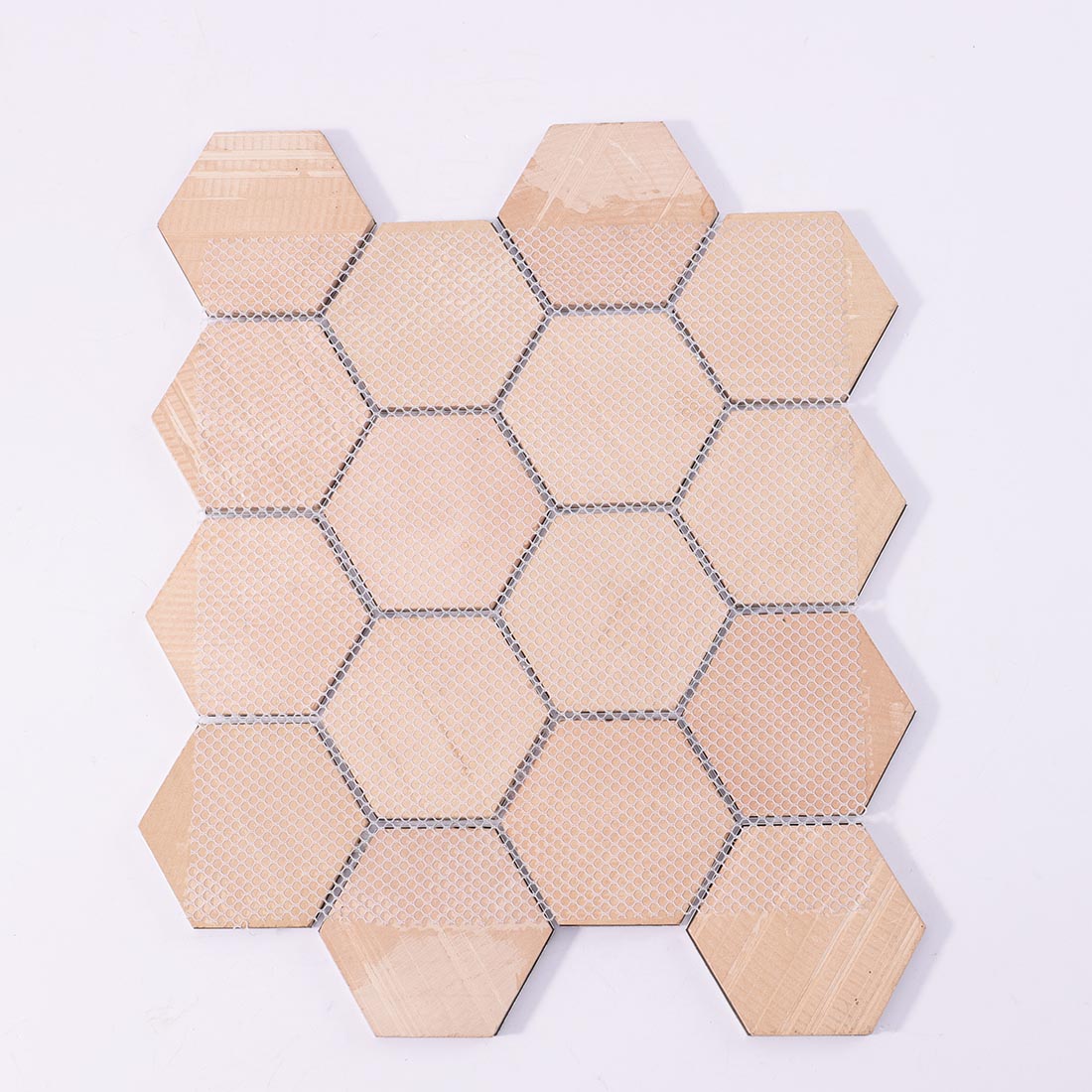 Mesh backing on reverse side of blue grey hexagon aluminum mosaic sheet