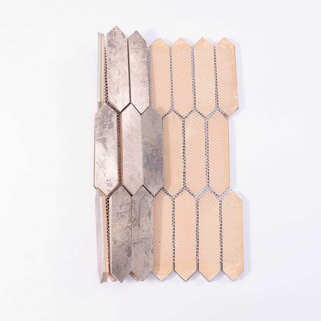 Mesh backing on reverse side of distressed antique silver picket aluminum mosaic sheet