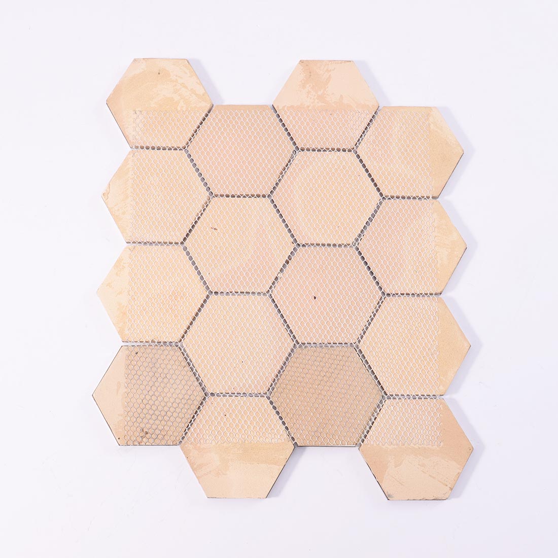 Mesh backing on reverse side of gold hexagon aluminum mosaic sheet