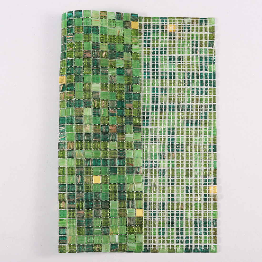 Front and mesh backing view of green glass mosaic tile sheet with gold accents