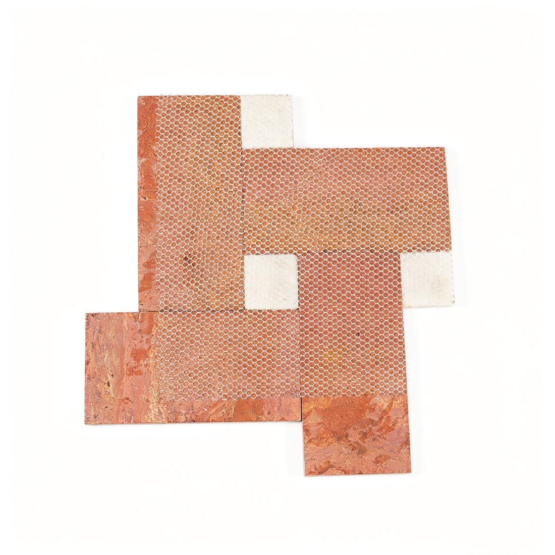 Mesh backing on the reverse side of red travertine mosaic