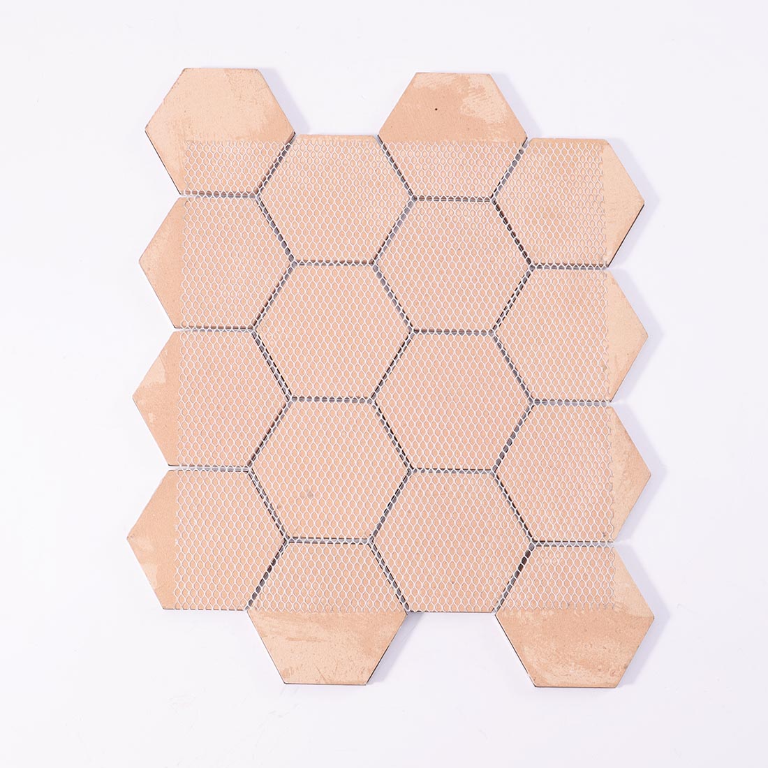 Mesh backing on reverse side of silver grey hexagon aluminum mosaic sheet