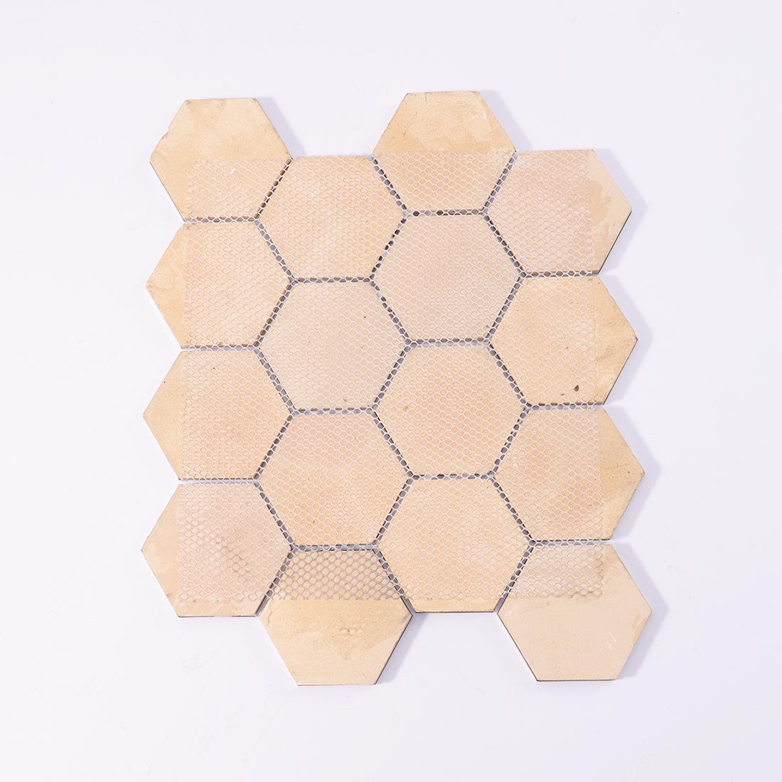 Mesh backing on reverse side of wood grain hexagon aluminum mosaic sheet