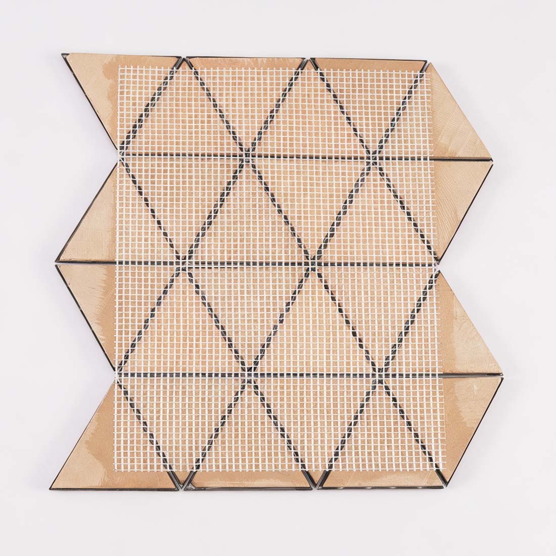 Back view of pink fan triangle metal mosaic tile with mesh mounted backing