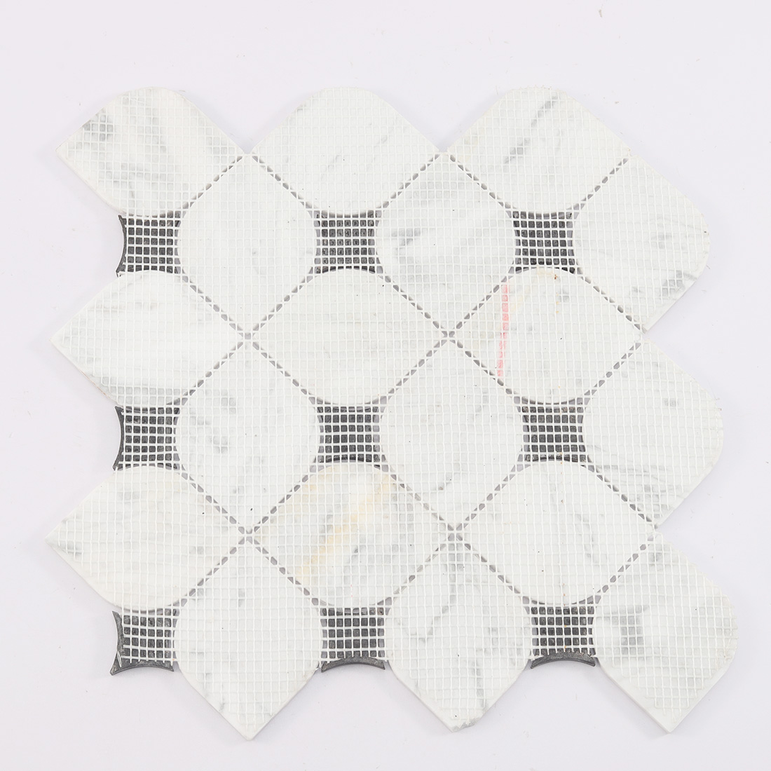 Mesh mounted back of white petal marble mosaic tile with black inserts