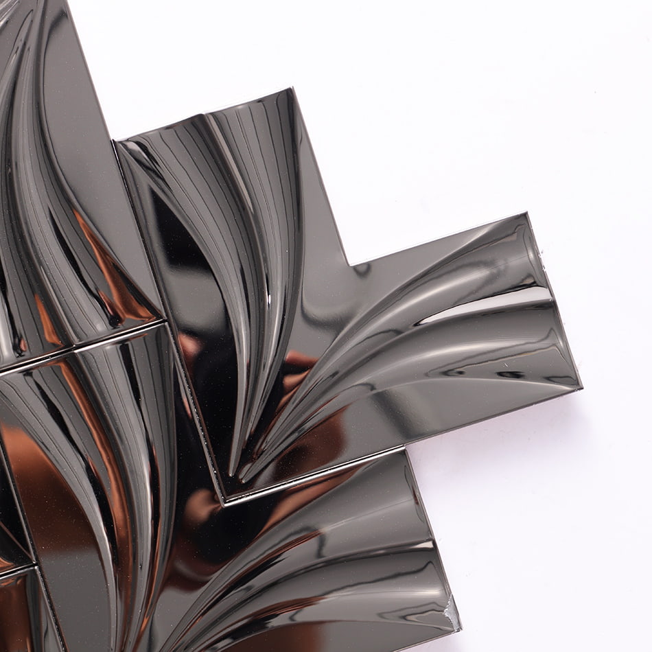 Corner detail of mirror black chevron stainless steel mosaic tile