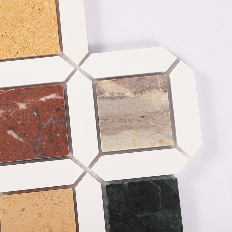 Corner detail of multicolor diamond marble mosaic with white border pieces