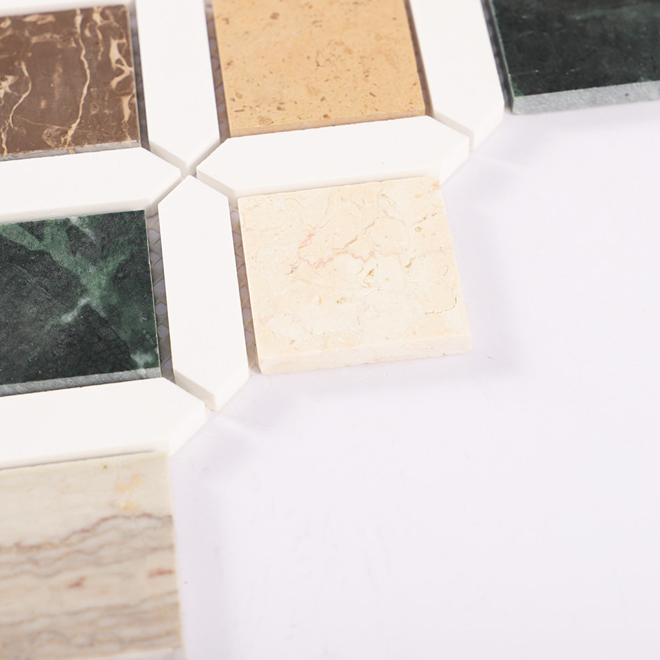 Detail of cream and green stone diamonds framed by white mosaic pieces