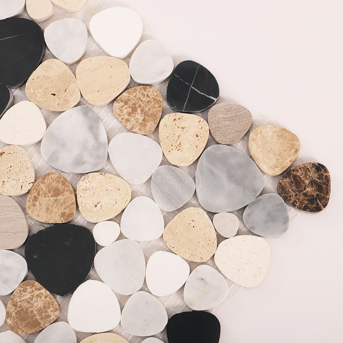 Corner close up of multicolor pebble marble mosaic tiles with mixed stone textures