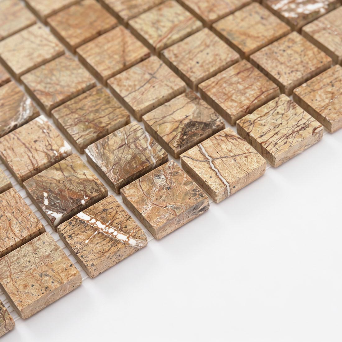 Angled view of brown and beige marble square mosaic tile with natural color variation