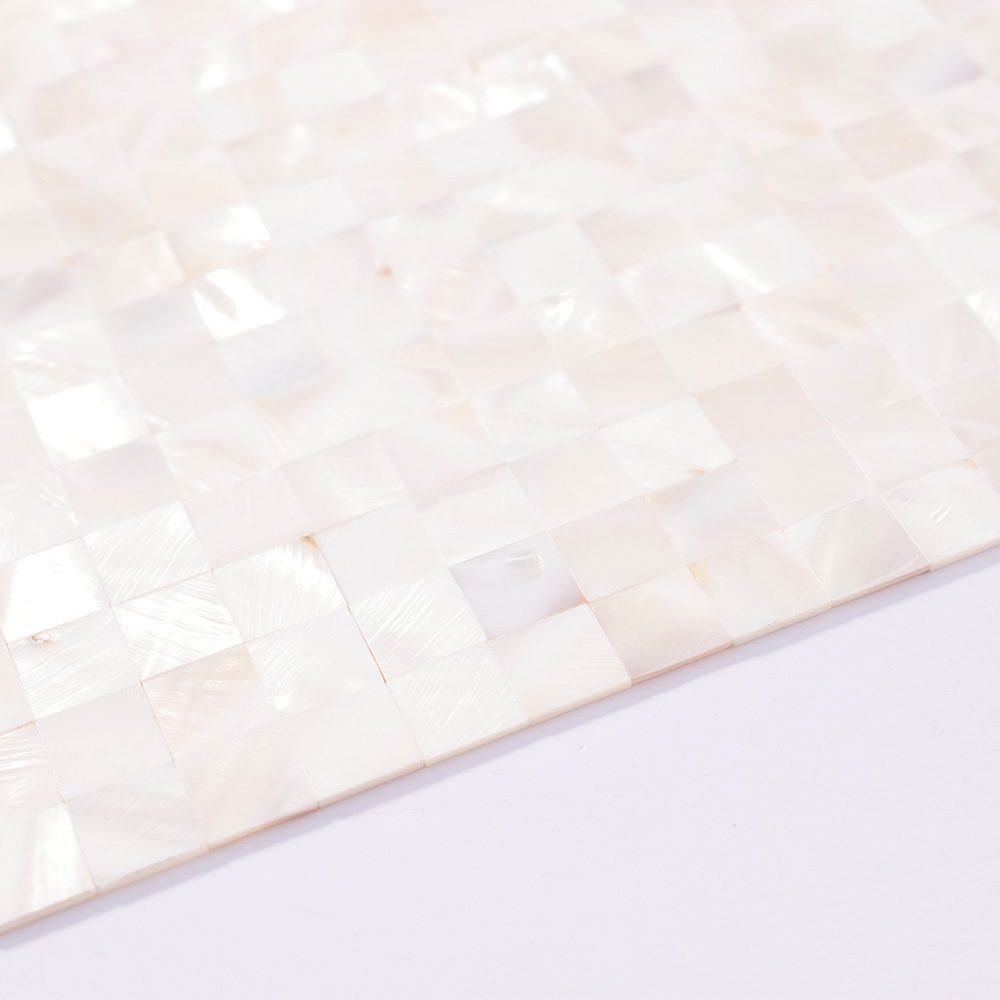 Edge detail of thin white shell square mosaic tile sheet.