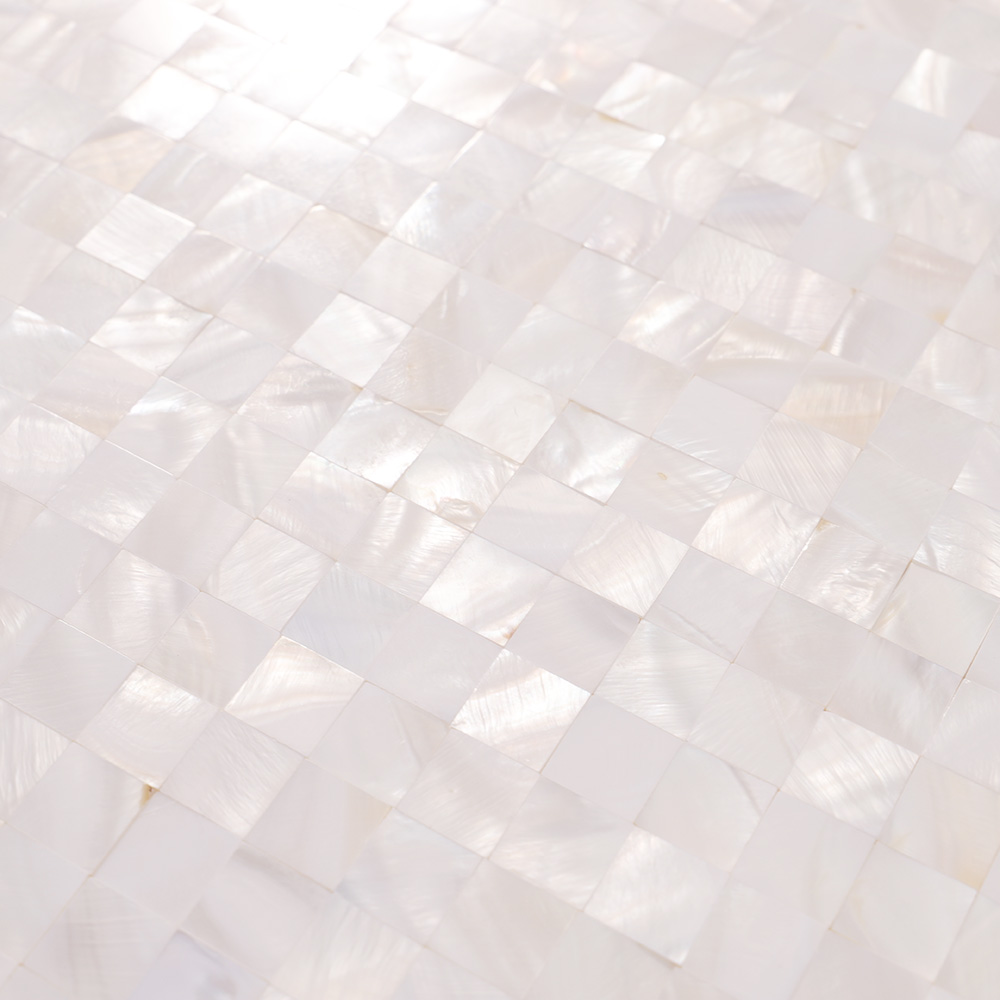 Surface close-up of glossy white shell square mosaic tile.