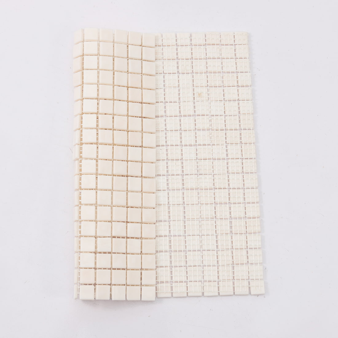 Mesh back view of pale blush pink square glass mosaic tile