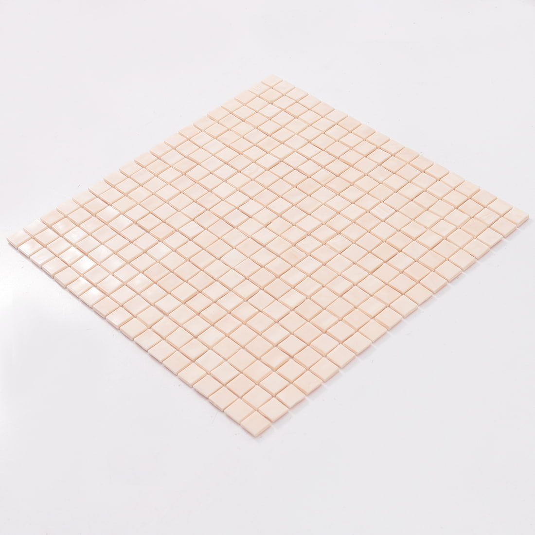 Perspective view of pale blush square glass mosaic tile sheet