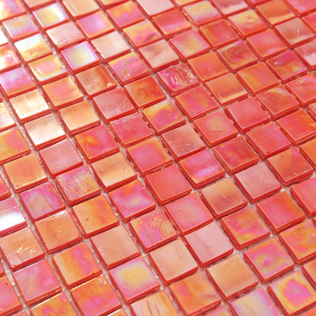 Close-up of pearlescent orange square glass mosaic tile surface