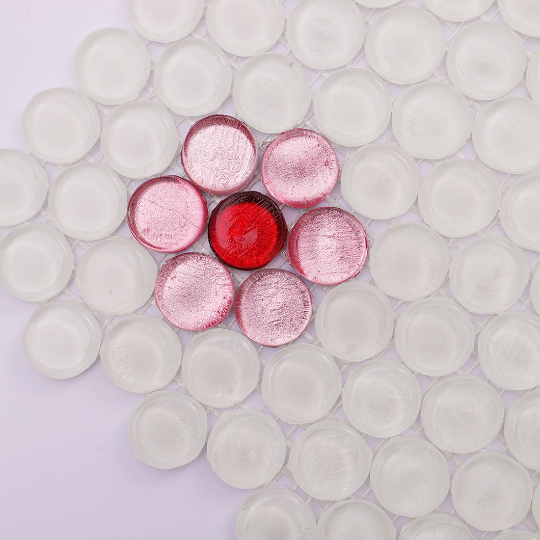 Pink foil flower accent set within white penny round glass mosaic tile