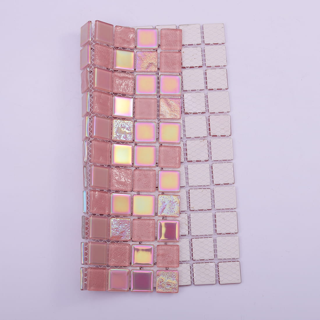 Pink iridescent square glass mosaic showing flexible mesh backing