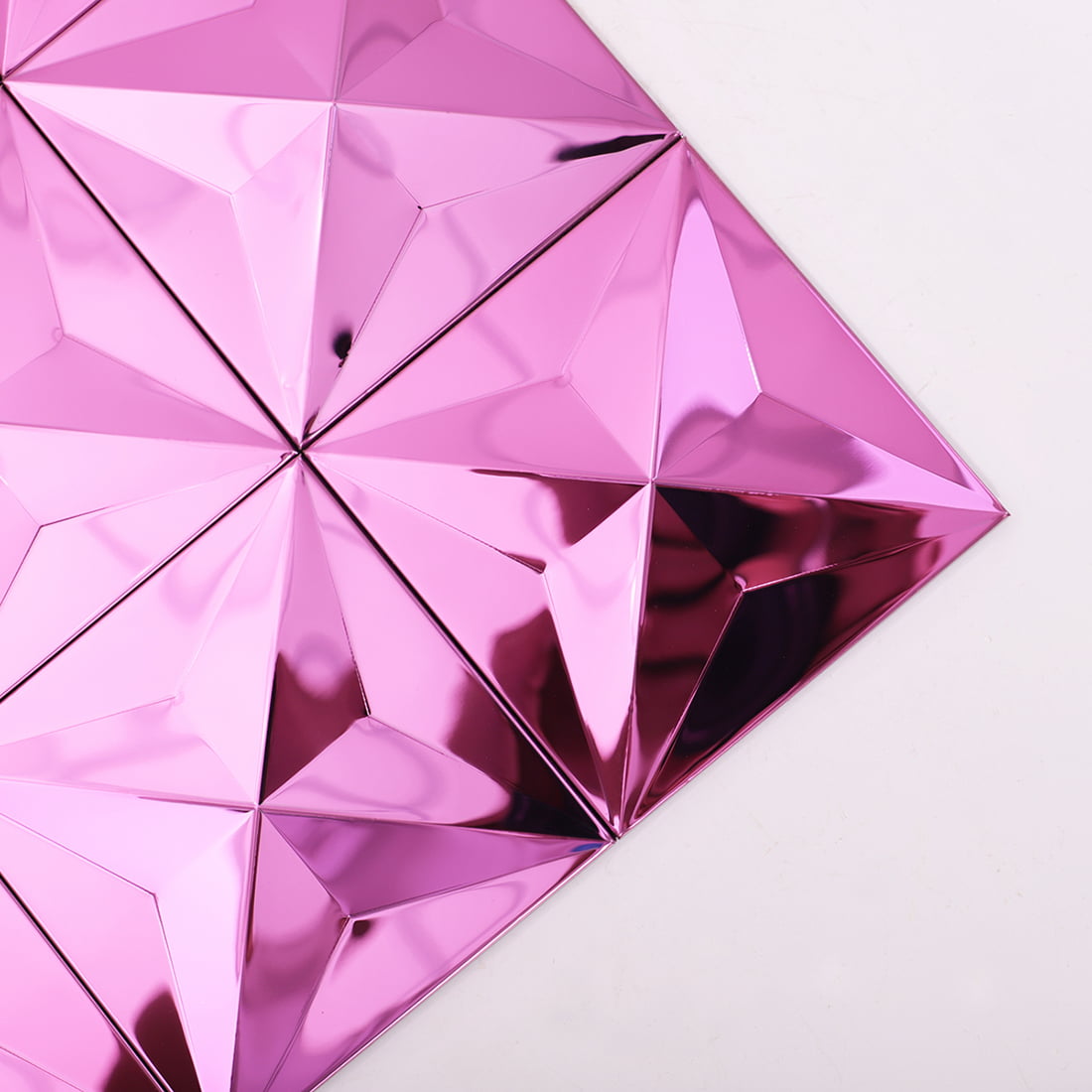 Close-up of pink mirror 3D square stainless steel mosaic tile