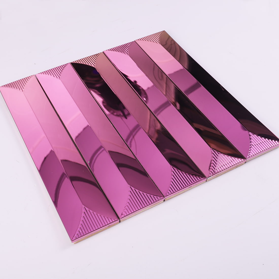Angled view of pink mirror long strip metal mosaic tile sheet