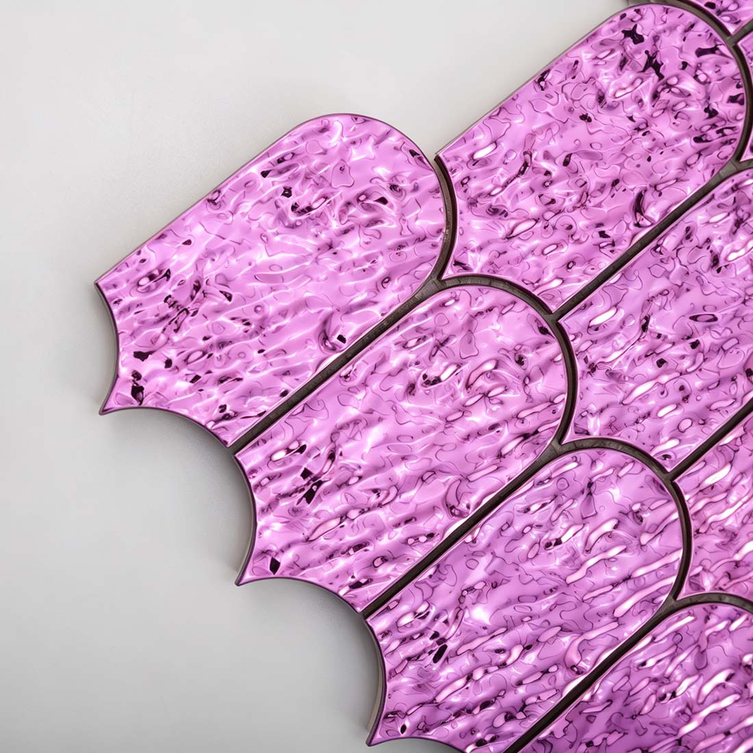 Side detail showing edge thickness and finish of pink purple fan metal tile