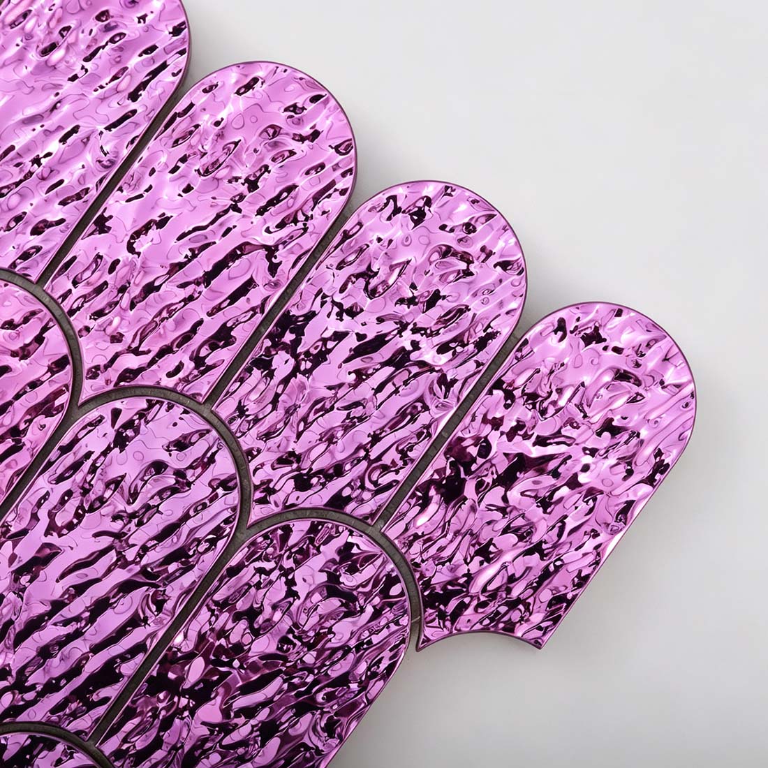 Close up view of pink purple fan metal mosaic tile textured individual chips
