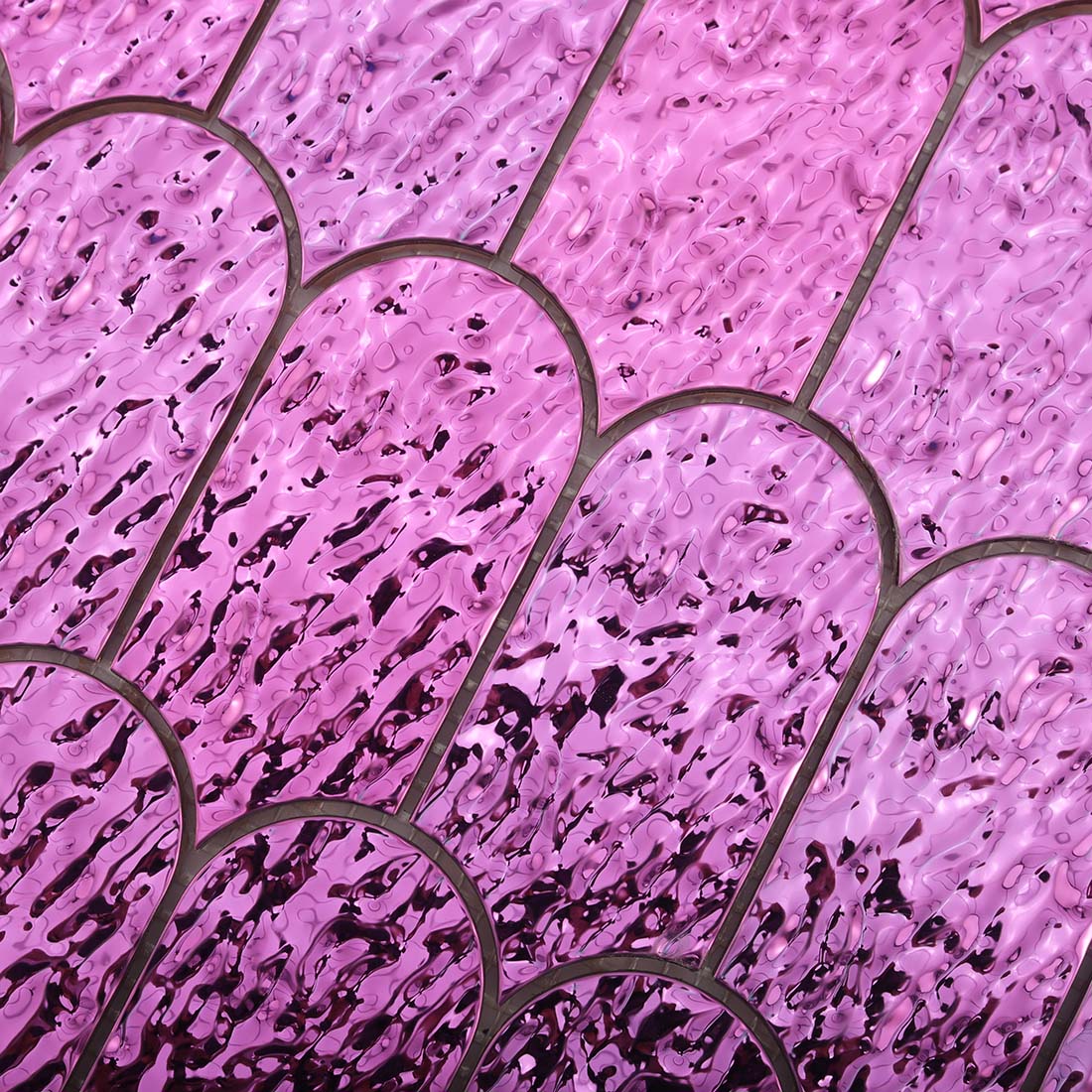 Top view of water ripple textured surface on pink purple fan stainless tile