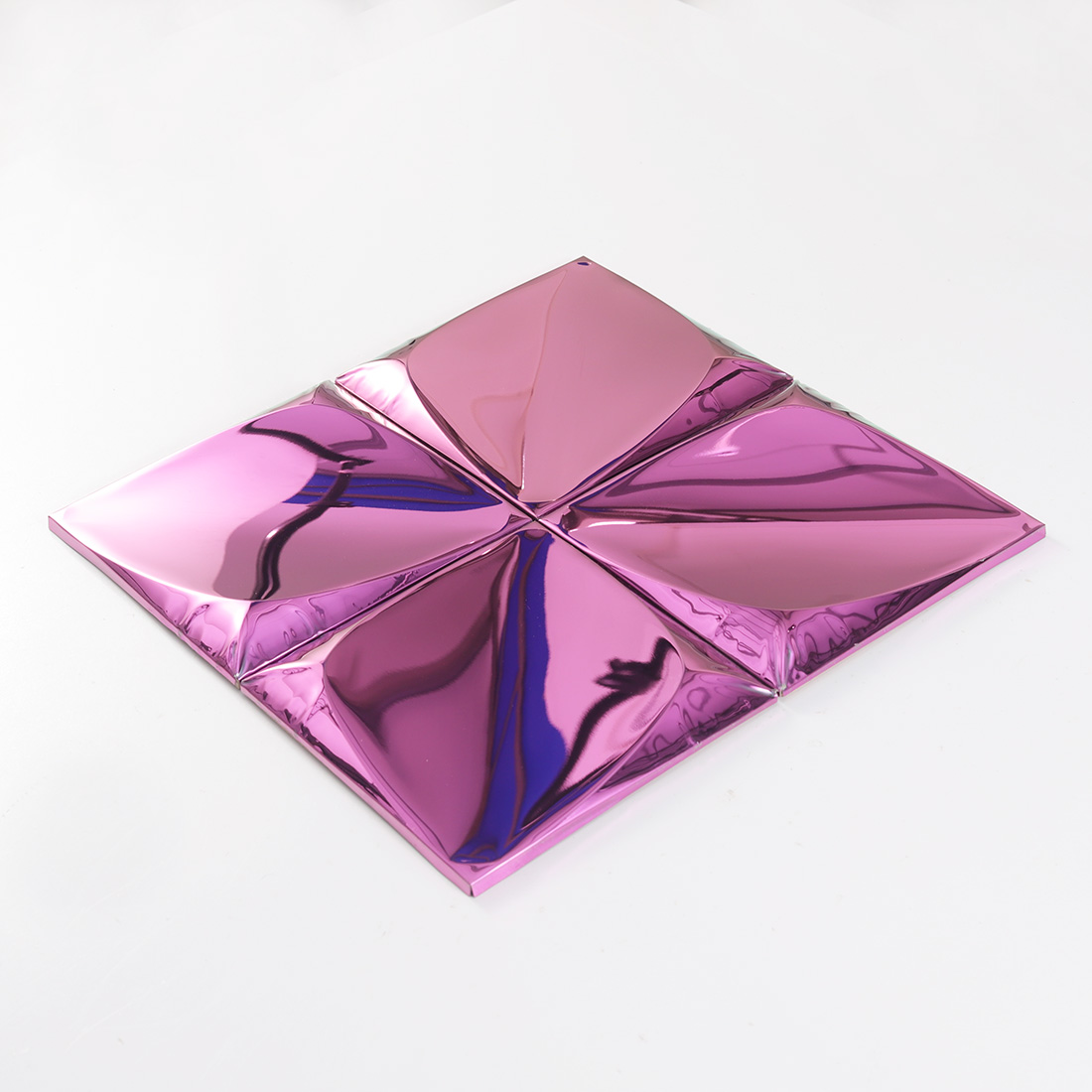 Perspective view of pink raised metal tiles with reflective 3D pyramid texture