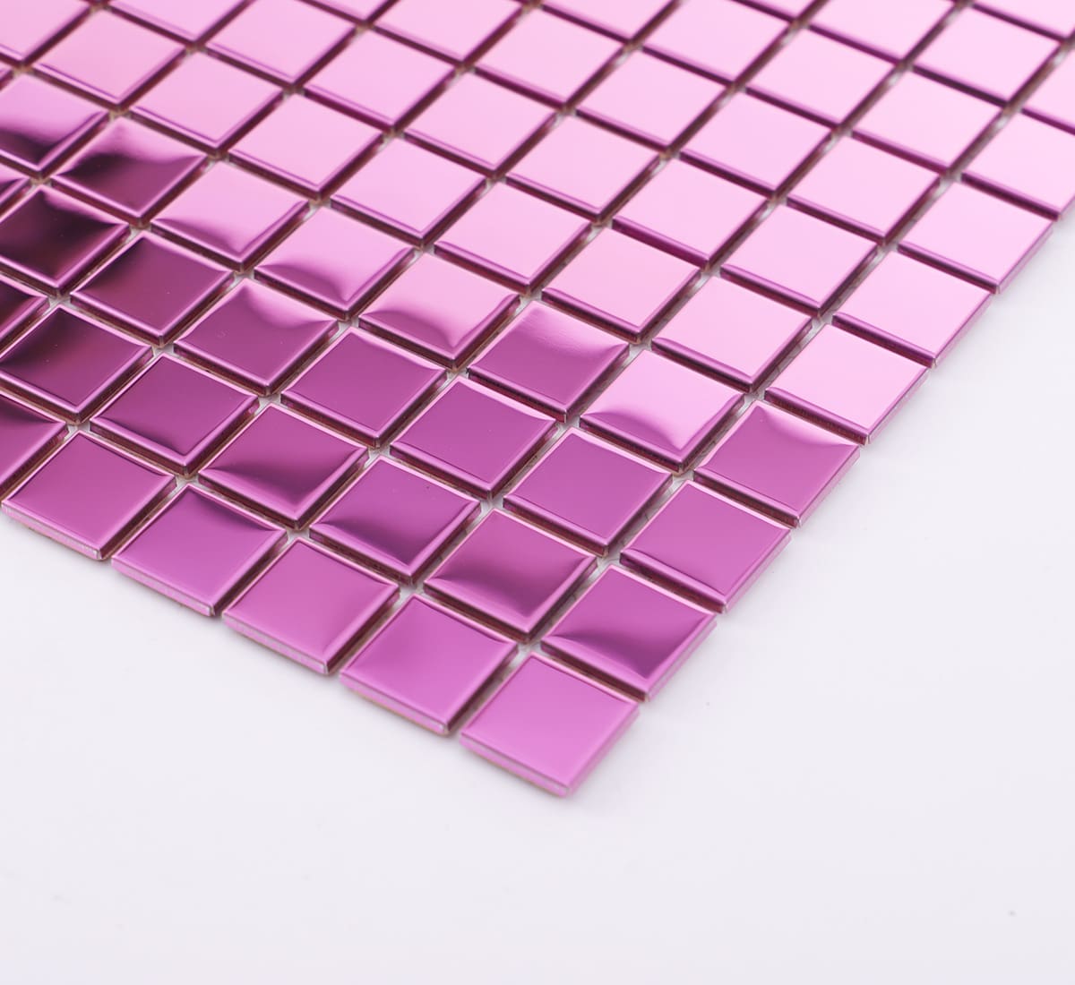 Angled view of pink square stainless steel mosaic with glossy raised chips