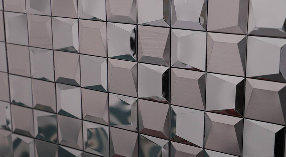 {"default":"Polished chrome metal 3D square wall tiles with a beveled geometric design."}
