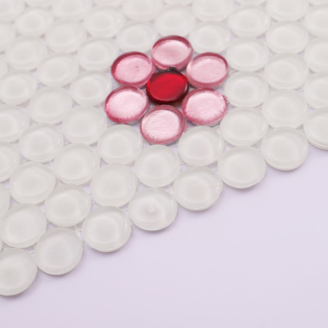 Close up view of red foil glass mosaic flower accent