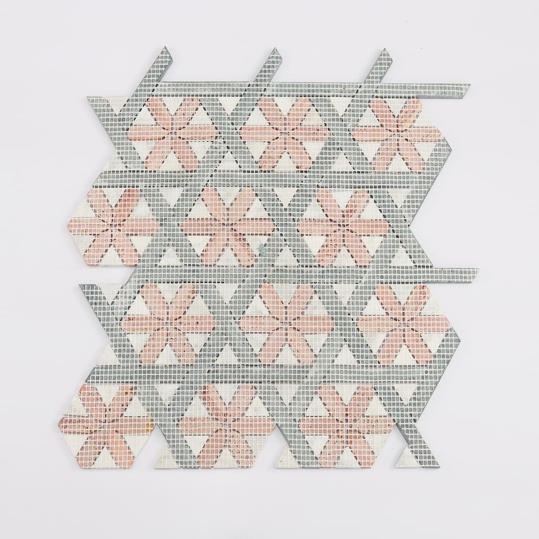 Back view of red and green geometric marble mosaic tile with mesh backing