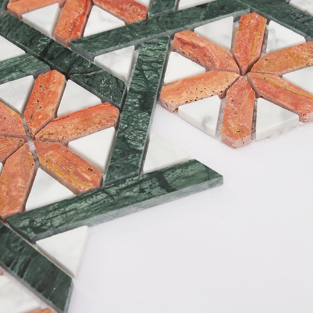 Side view of red and green marble mosaic showing layered stone pieces