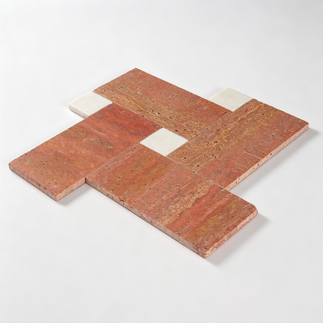 Perspective view of laid red travertine basketweave mosaic sheet