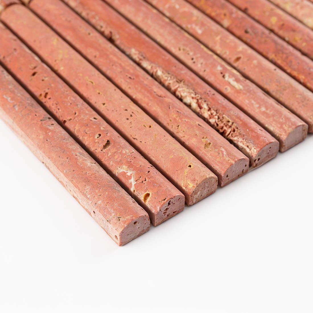Precise edge profile of red travertine convex brick stacked tile.