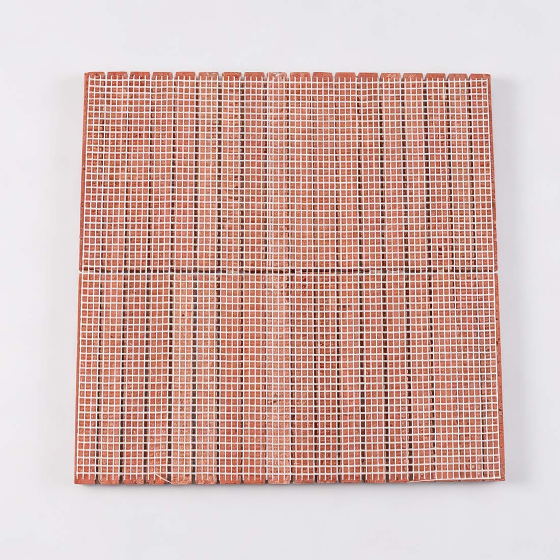 Professional mesh-mounted backing of red travertine brick mosaic tile.