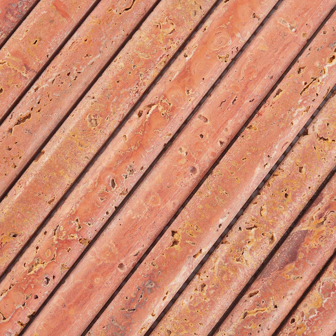Red travertine convex strip tile surface detail with porous texture
