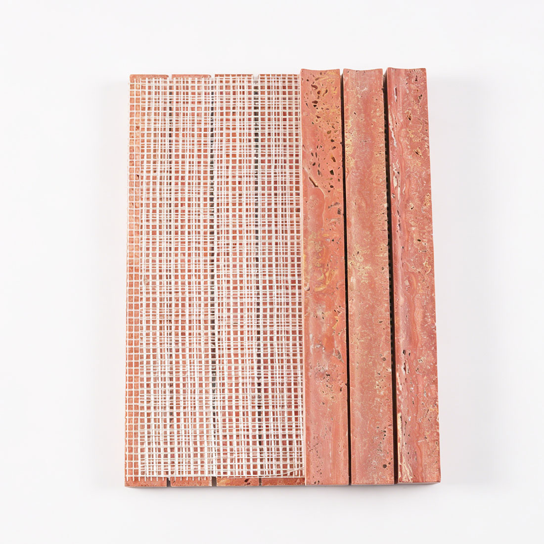 Mesh backing on red travertine fluted stacked tile.