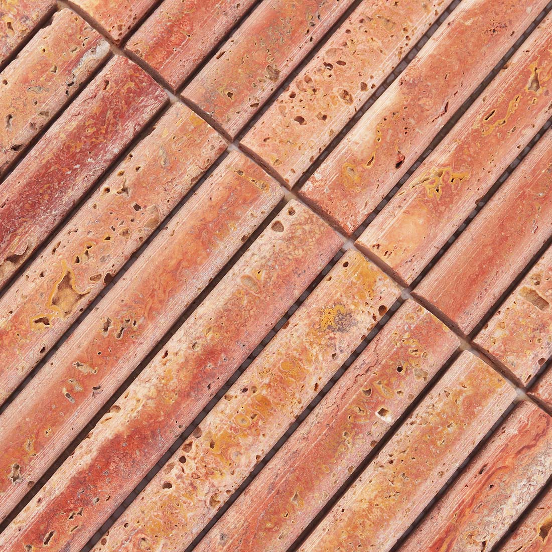 Detailed surface texture and natural pitted pattern of red travertine.