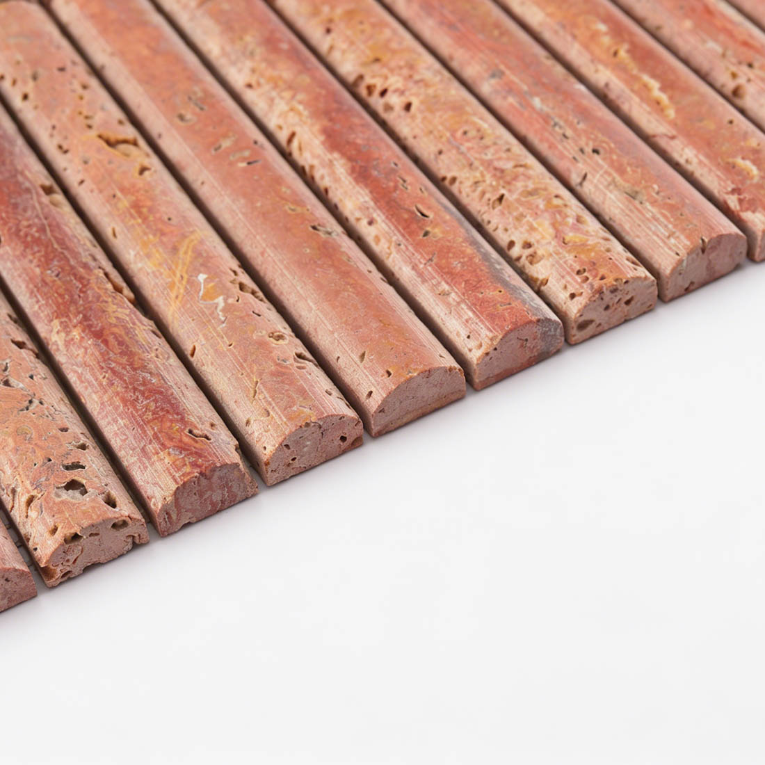 Side profile view highlighting the semi-circle rod contour of red travertine.