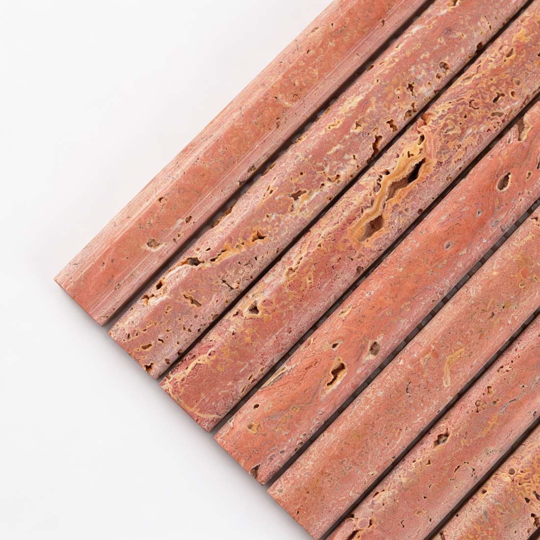 Close up of red travertine rounded liner tile with natural holes